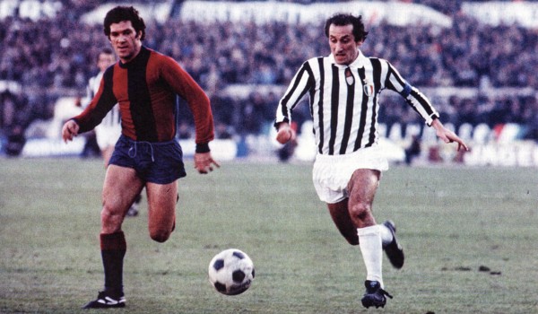 Franco Nanni from Bologna (left) and Giuseppe Furino from Juventus (right) chase the ball during a match between Bologna and Juventus ca. 1975-1978