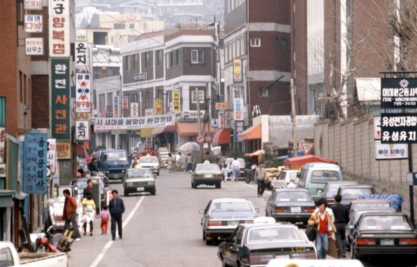 1987 - A street in the market district of the city (possibly Itaewon S. Korea).
