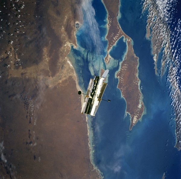 HST, flyaround of the telescope after deployment on this second servicing mission