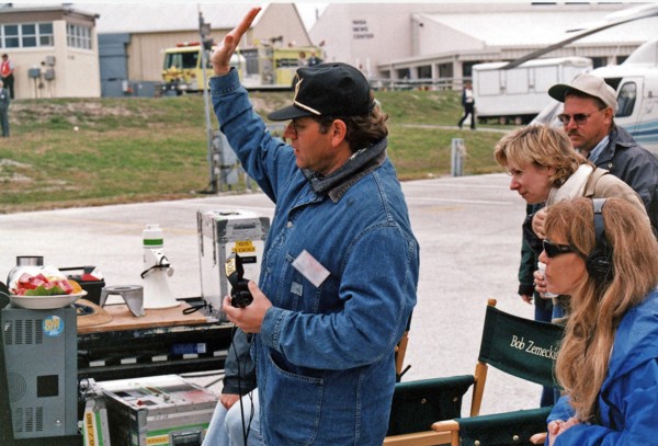 Robert Zemeckis, director/producer, and other Warner Bros. crew members oversee the filming of scenes for the movie "Contact" at Kennedy Space Center's Launch Complex 39 Press Site on January 30 ca. 1...