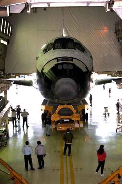 The orbiter Atlantis rolls out of the Orbiter Processing Facility at Kennedy Space Center (KSC) for its journey to the Shuttle Landing Facility ca. 1997