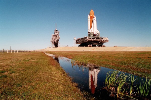 1995 - A massive 19 million pounds-plus (8.6 million kilograms) of Space Shuttle, support and transport hardware inch toward Launch Pad 39A from the Vehicle Assembly Building.