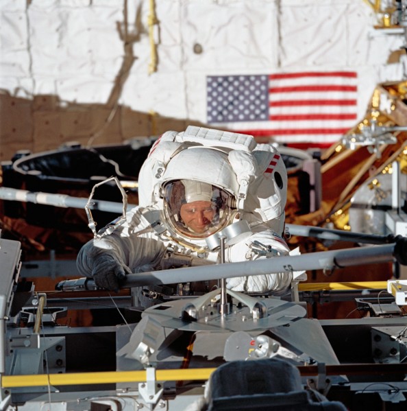 (14 May 1992) --- Astronaut Thomas Akers, STS-49 mission specialist, grabs a strut device as fourth period of extravehicular activity (EVA) gets underway in the Space Shuttle Endeavour's cargo bay.