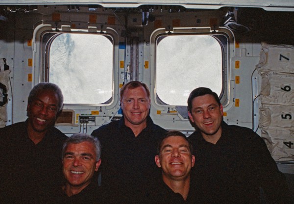 In orbit crew group portrait in the aft flight deck.