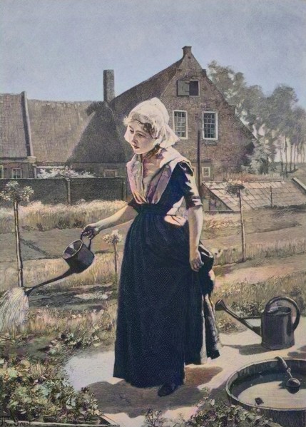 Girl watering in the home garden