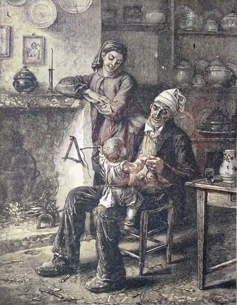 Grandfather plays with the grandson on his knee