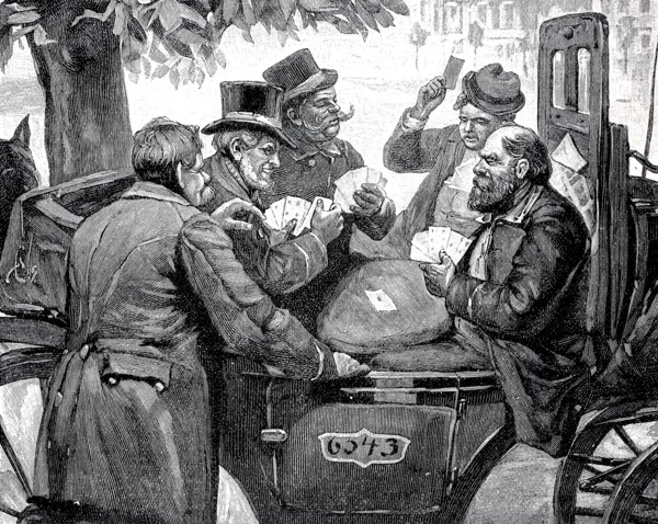 Men playing cards in a carriage