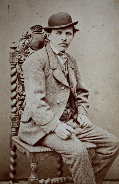 Photo of a man with suit and bowler hat