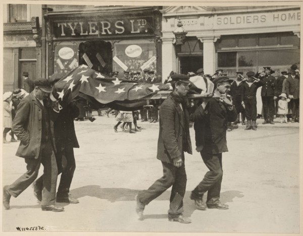 Carrying a body recovered from the sinking of the Lusitania