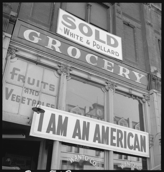 I Am An American sign outside grocery store