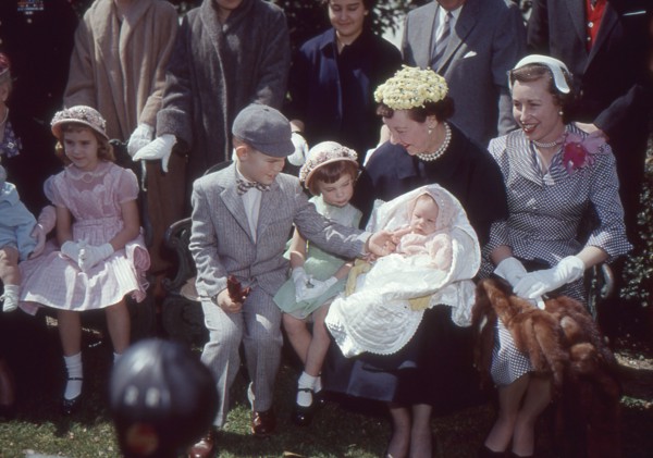 First Lady Mamie Eisenhower, holding her youngest grandchild and sitting with her daughter-in-law Barbara (right) and three other grandchildren. Washington, DC, 1955.