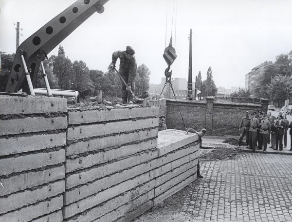 After The Wall Was Damaged at Acker, Corner Bernauerstrasse, Volksarmy Workers Are Fixing The Wall