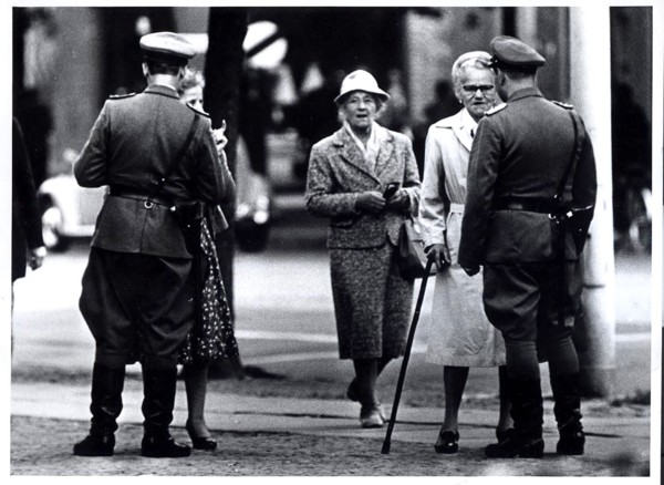 August 1961 - Two 'Vopos' (East German Police) Check East Berliners Seeking to Pass From