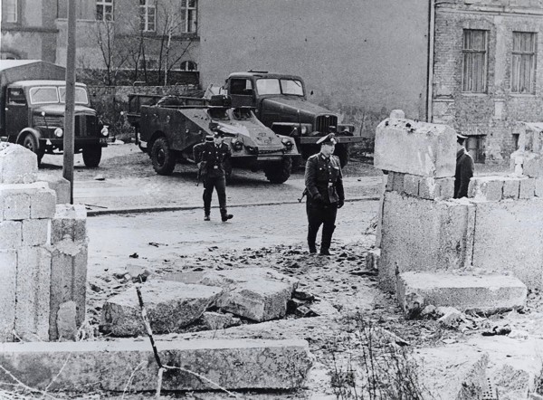 The refugees rammed the wall with a heavy truck and then fled on foot into the French Sector of