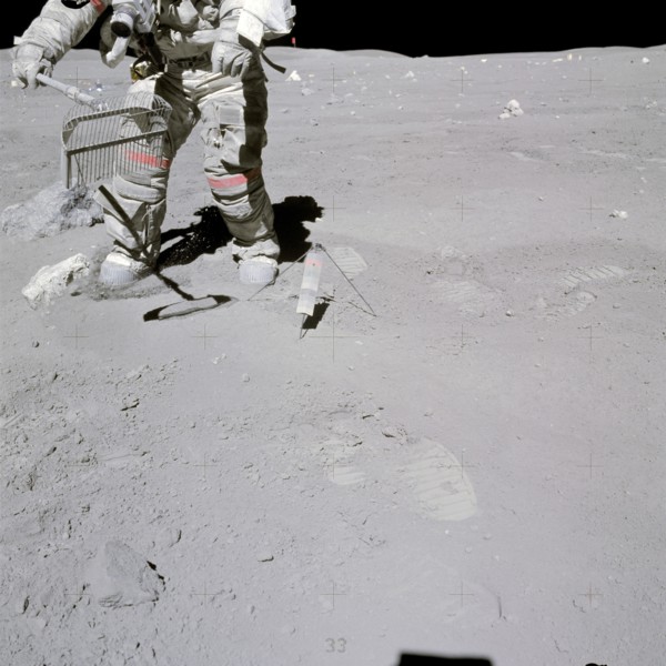 Astronaut John W. Young collects samples