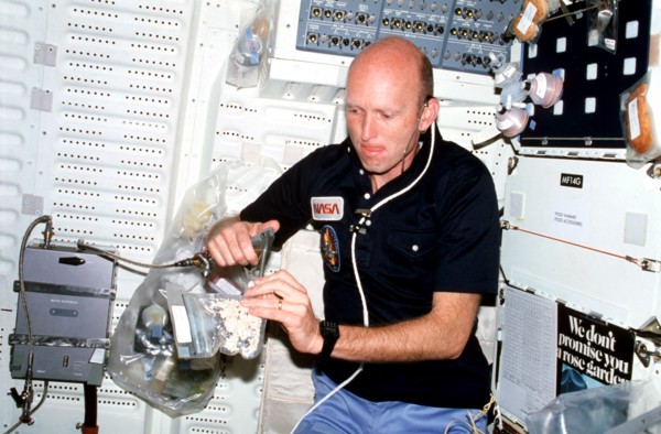 Pilot Fullerton, wearing communications kit assembly (assy) mini headset