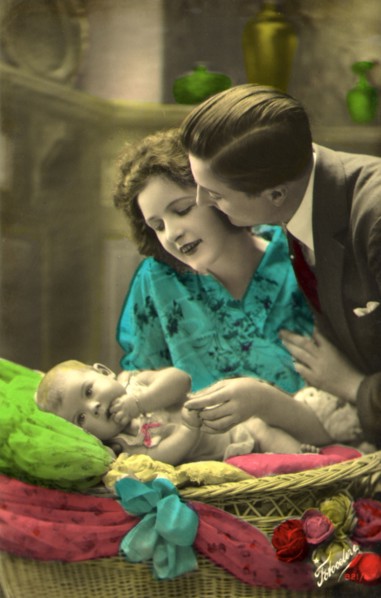 Couple admiring an Infant.