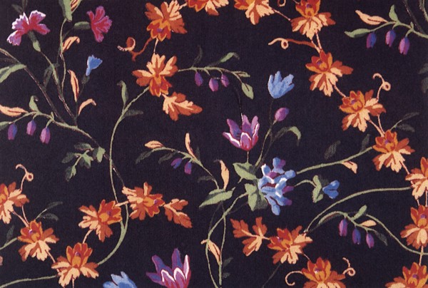 Orange and purple flower repeat pattern on dark background.
