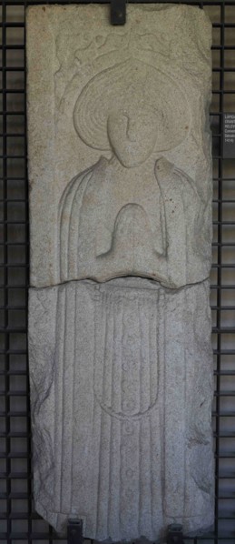 Tombstone with prayer figure in bas-relief