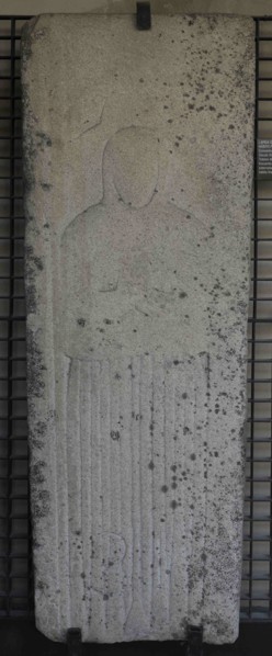 Tombstone with bas-relief depicting a woman wearing the Franciscan habit