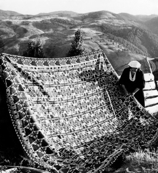 Italy. Calabria. San Giovanni in Fiore. a woman embroidering a blanket. 1950