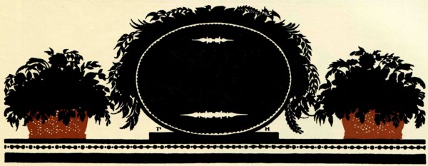 Black oval plaque for inscription flanked by two planters with flowers.