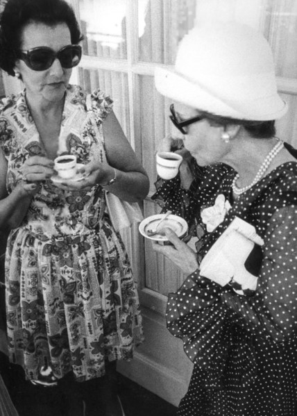 Two women drinking a cup of coffee, 60's