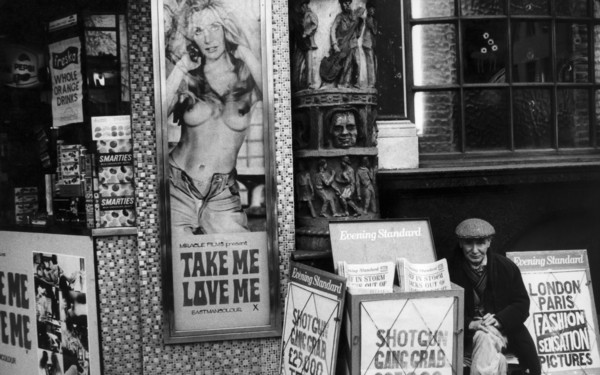 Uk, london, street vendor of evening standard newspaper, 70's