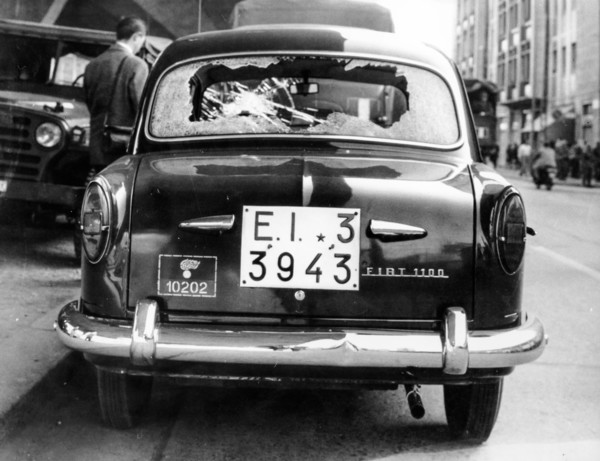 Car of the police destroyed by protesters, Rome, 1966