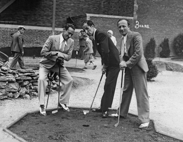 Men Playing Miniature Golf