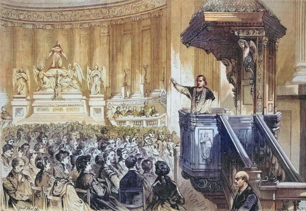 Monsignor Bauer preaching from the pulpit at the Church of St. Mary Magdalene