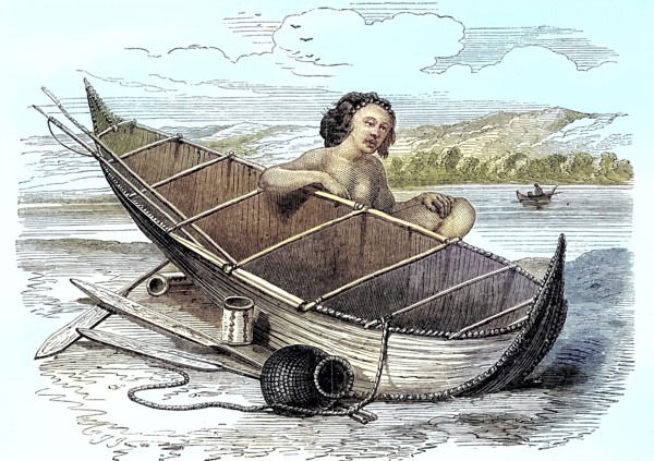 Woman with a canoe on Tierra del Fuego