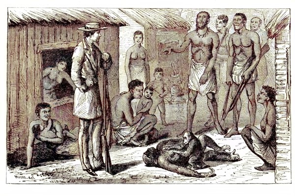 Natives standing in front of a hunter who shot a gorilla that had a cub