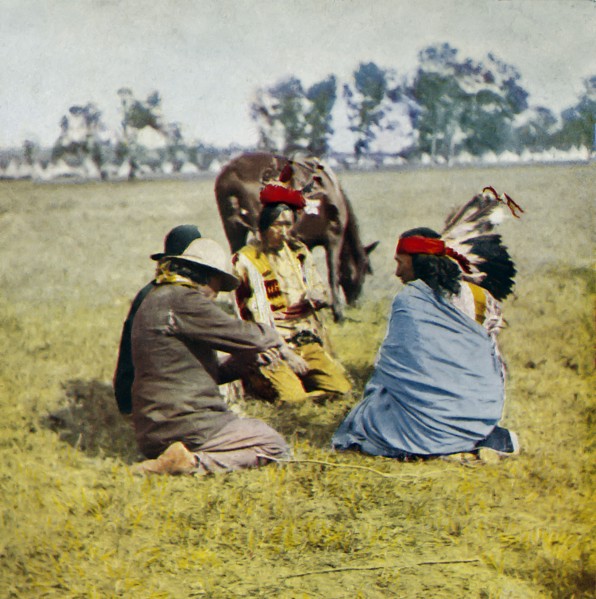 Passing the peace pipe around the council, native American Indians.