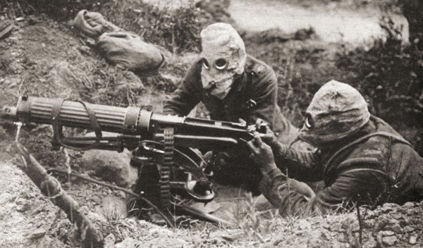 Two soldiers wearing respirators to protect them from poison gas during WWI.