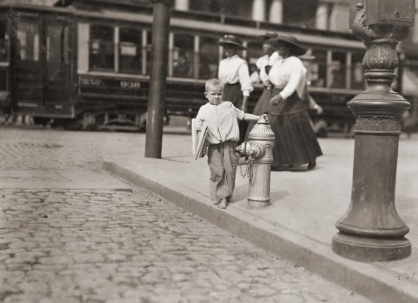 Child newspaper vendor.