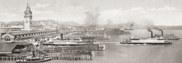 The ferry slips in front of the The San Francisco Ferry Building.