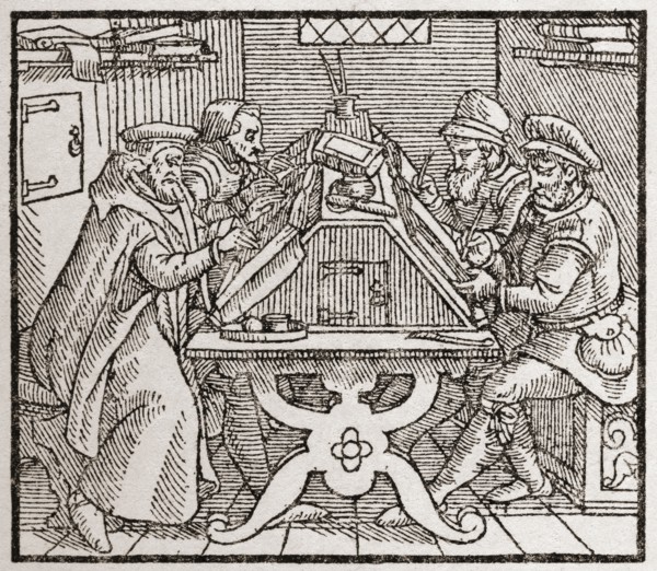 Scribes at work during the Tudor period in England.