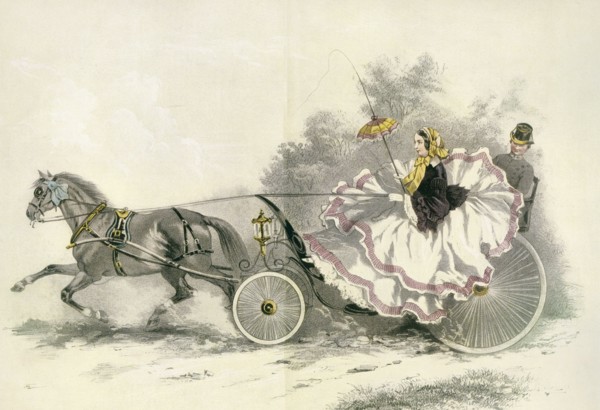 Lady wearing a crinoline and driving a 19th century horse and landau.