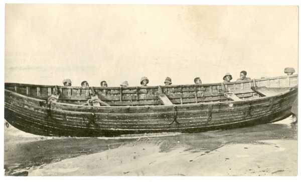 Wooden boat at water's edge
