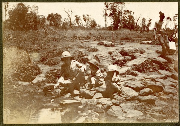 African man by river rapids