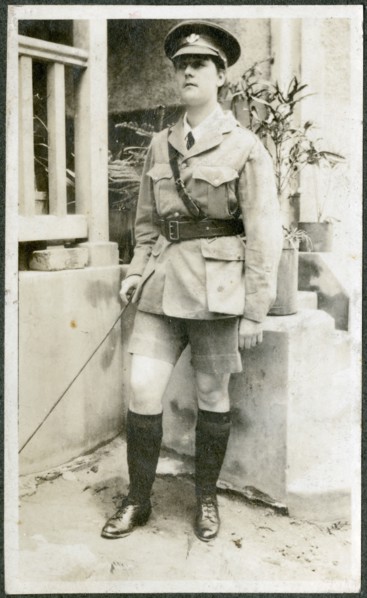 Portrait of European woman dressed up in army uniform