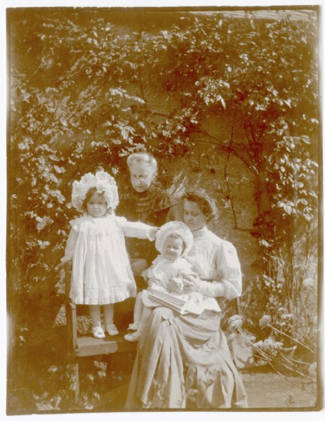 Children and two women in garden, Gikiyanakanda plantation