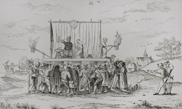 Europe. A juggler's stage set in a village. On stage a juggler and a medicine seller talking to the