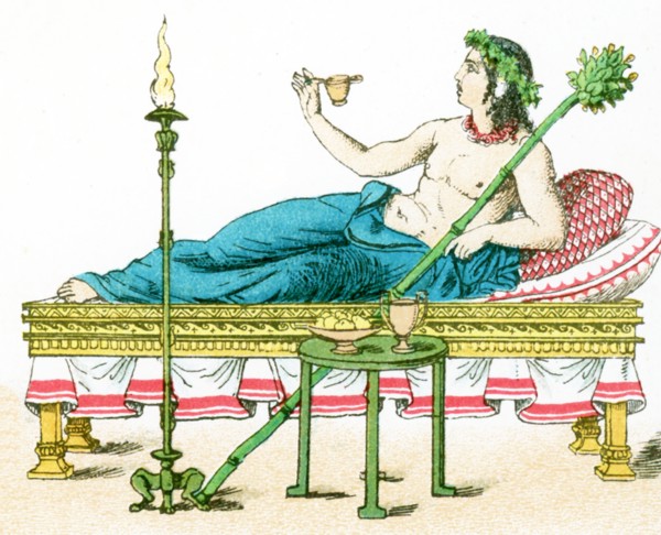 The illustration here shows an ancient Greek couch with table and candelabrum, and a flaming torch.