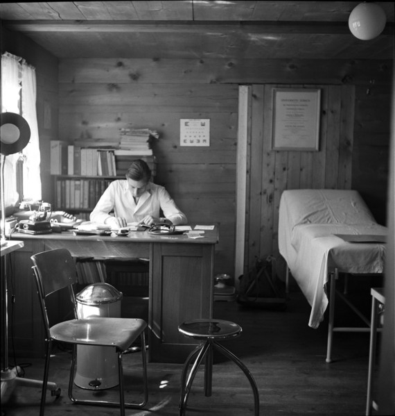 Physician in his surgery, in the 40s