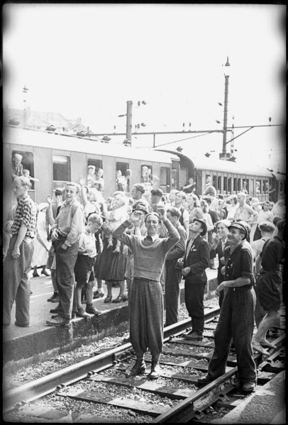 After World War 2: Swiss people cheering at POWs - presumably Italians - going home, 1946.