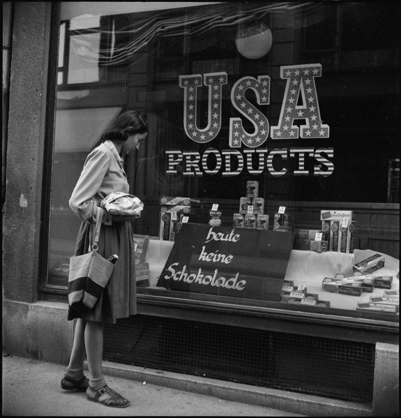 Woman looking at goods on display, around 1944.