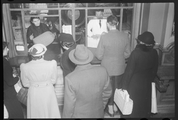 People queue at post office counter, 1940