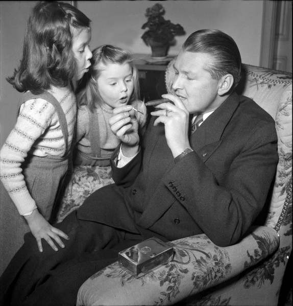 Willy P. Daetwyler, at home with family around 1957.
